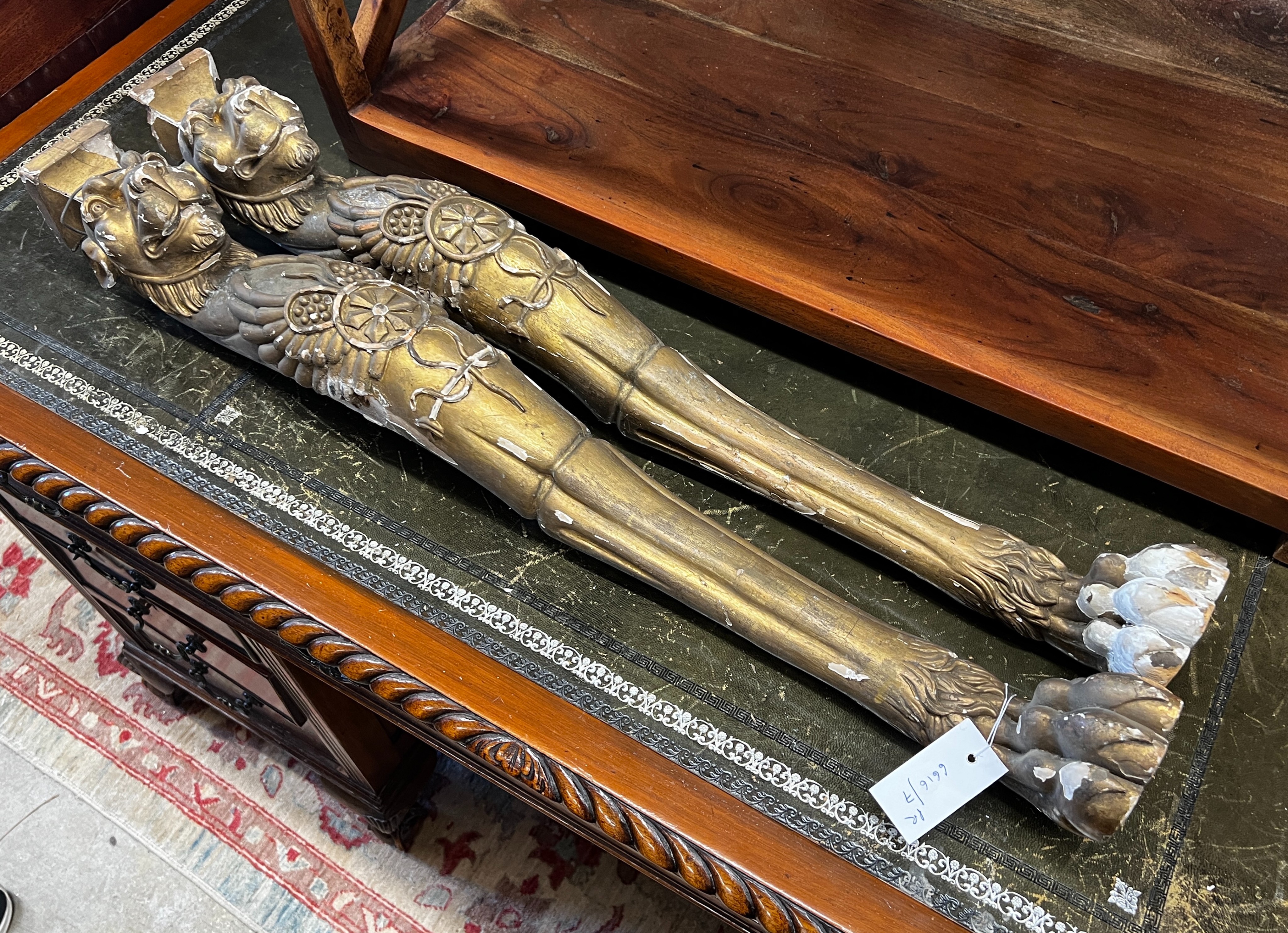 In the manner of Thomas Hope, a pair of 19th century carved giltwood and composition monopodia, height 85cm